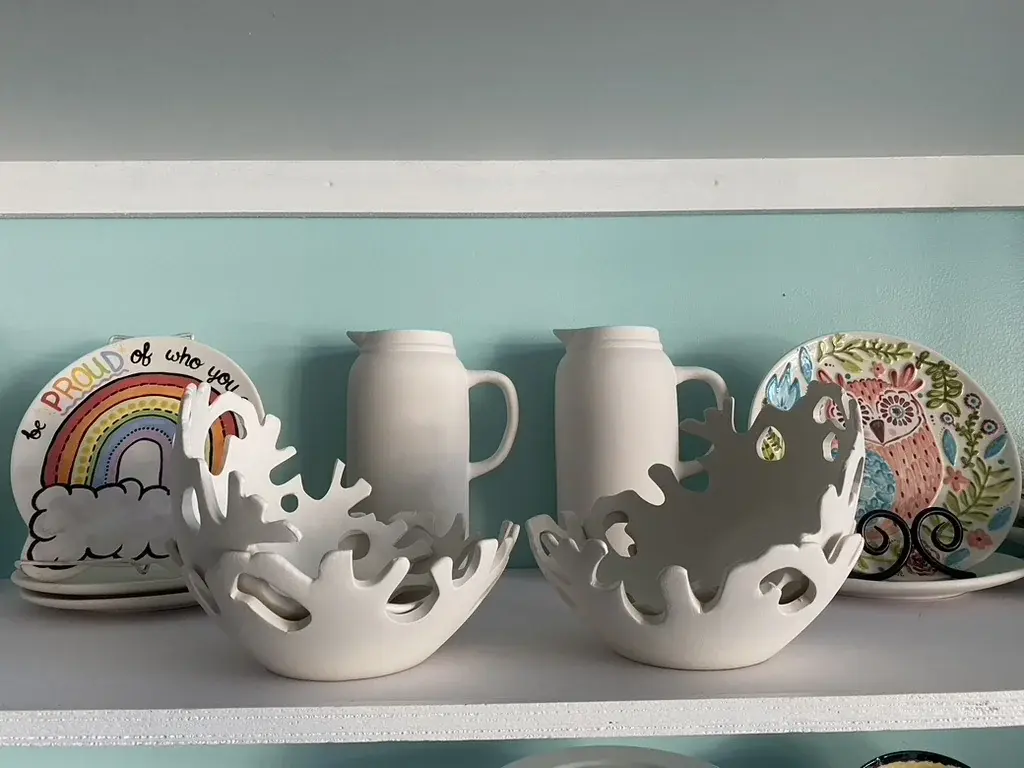 Painted ceramic piece from the studio wall