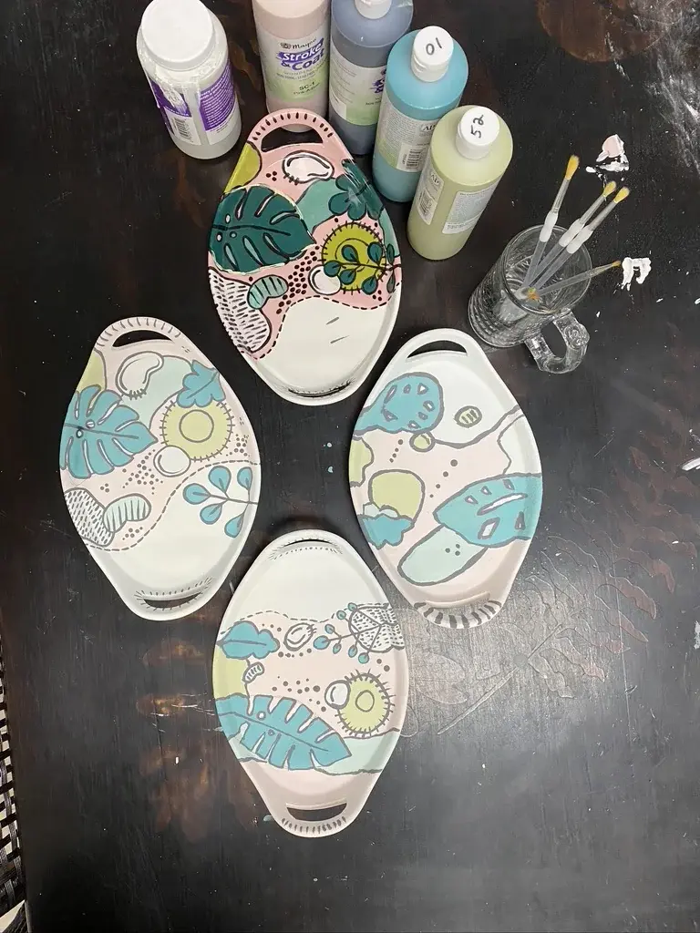 Hand-painted ceramic from the studio gallery wall